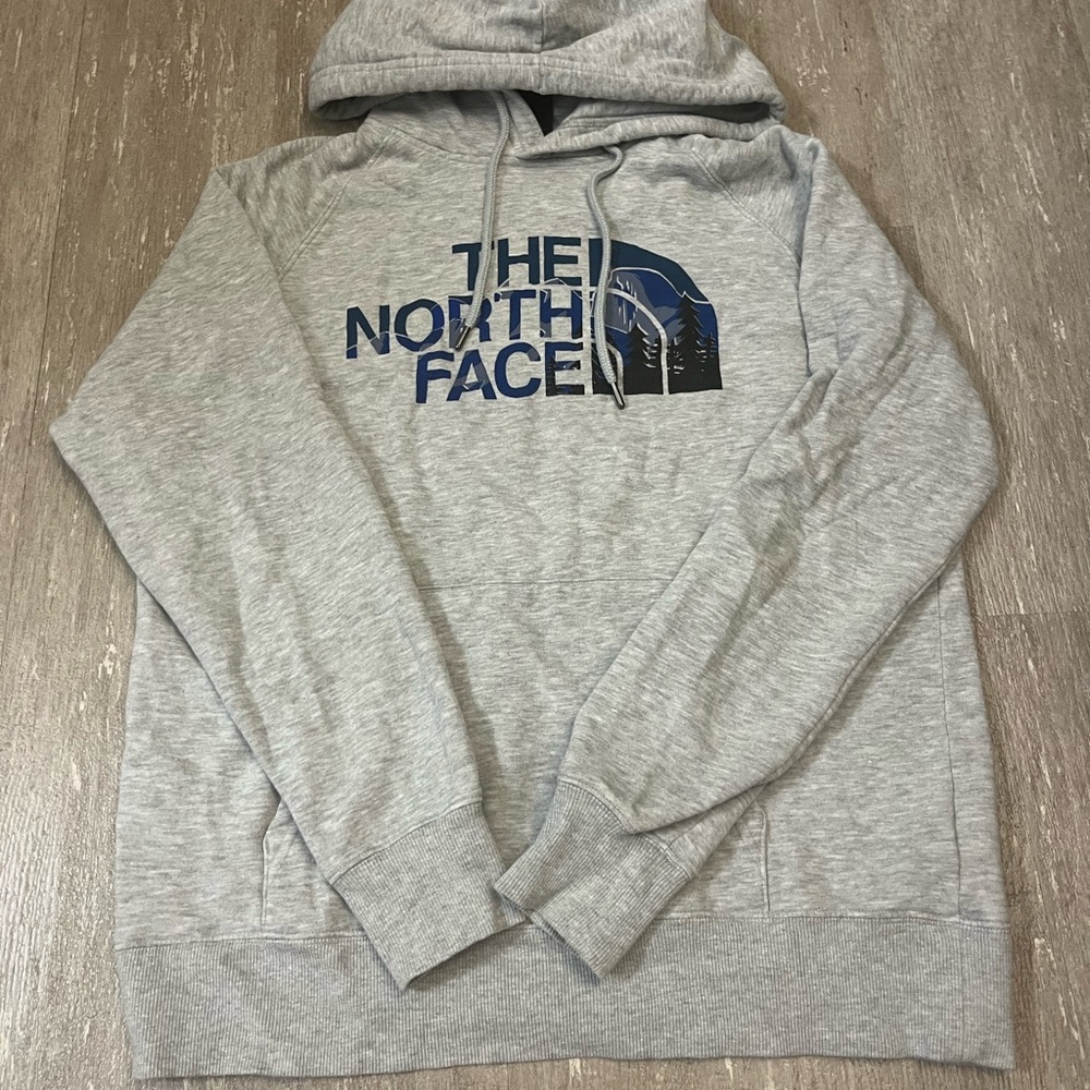 The North Face Women’s Light Gray Hoodie with Blue Logo